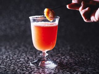 A Close Up Of A Glass Of Orange Juice