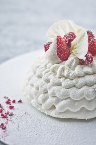 A Close Up Of A Piece Of Cake Covered In Snow