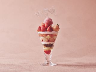 A Glass With A Drink And Fruit In It